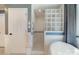 Modern bathroom features a glass block shower, white fixtures, and stylish decor at 9500 Windygap Rd, Charlotte, NC 28278