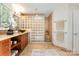 Bathroom featuring glass block shower, tile floors, and warm lighting at 9500 Windygap Rd, Charlotte, NC 28278