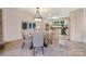 Bright dining area with tile flooring, a kitchen island and a charming overhead light fixture at 9500 Windygap Rd, Charlotte, NC 28278