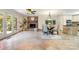 Bright dining space with tile flooring, a fireplace, and a door to the outside patio at 9500 Windygap Rd, Charlotte, NC 28278