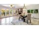 Cozy dining space featuring tile floors, fireplace, and a door to the outside patio at 9500 Windygap Rd, Charlotte, NC 28278