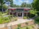 Stylish home with balconies, outdoor seating, and manicured landscaping for ultimate relaxation at 9500 Windygap Rd, Charlotte, NC 28278