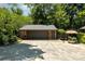 Large garage with a full driveway and surrounding landscape at 9500 Windygap Rd, Charlotte, NC 28278