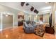 Open living room with kitchenette, comfortable seating, TV, and decorative ceiling fans at 9500 Windygap Rd, Charlotte, NC 28278