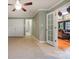Spacious room with tile floor, fan, and french doors leading to another living space at 9500 Windygap Rd, Charlotte, NC 28278