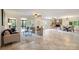 Open living space featuring tile floors, fireplace, and access to outdoor patio at 9500 Windygap Rd, Charlotte, NC 28278
