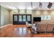 Spacious living room featuring stylish floors, a comfortable couch, and large windows offering scenic views at 9500 Windygap Rd, Charlotte, NC 28278
