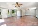 Large living room with big windows and neutral paint at 9500 Windygap Rd, Charlotte, NC 28278