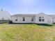 Spacious backyard featuring well-maintained green grass at 10031 Orchard Grass Ct, Charlotte, NC 28278