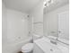 Bathroom with shower-tub combo, toilet, and a vanity with a sink and mirror at 10031 Orchard Grass Ct, Charlotte, NC 28278
