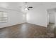 An open bedroom provides ample natural light and modern ceiling fan at 10031 Orchard Grass Ct, Charlotte, NC 28278