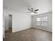 This bedroom features wood-look floors, a ceiling fan with lights, a window, and a closet at 10031 Orchard Grass Ct, Charlotte, NC 28278