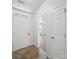 Bright entryway features tile flooring with a view into the open-concept living space at 10031 Orchard Grass Ct, Charlotte, NC 28278