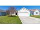 Charming one-story home with a well-maintained front lawn and an attached two-car garage at 10031 Orchard Grass Ct, Charlotte, NC 28278