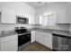 Modern kitchen with stainless steel appliances and granite countertops at 10031 Orchard Grass Ct, Charlotte, NC 28278