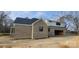 New construction home featuring brick siding, black trim, and an attached garage, blending modern and traditional styles at 1009 Marthas Meadow Ln # 5, Monroe, NC 28112