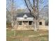 Charming brick home with a covered front porch and classic architectural details, set among mature trees at 1009 Marthas Meadow Ln # 5, Monroe, NC 28112