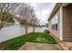 Fenced backyard with lush green grass, mature trees, and well-maintained landscaping at 1022 Bimelech Dr, Indian Trail, NC 28079