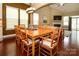 Spacious dining area with hardwood floors, large dining table and lighting fixture at 1022 Bimelech Dr, Indian Trail, NC 28079
