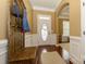 Inviting foyer featuring hardwood floors, half wall wainscoting, and neutral paint at 1022 Bimelech Dr, Indian Trail, NC 28079
