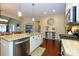 Bright kitchen with granite countertops, stainless steel appliances, and hardwood floors at 1022 Bimelech Dr, Indian Trail, NC 28079