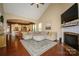 Living room with fireplace, hardwood floors, opening to kitchen and dining area at 1022 Bimelech Dr, Indian Trail, NC 28079