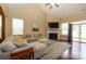 Living room with hardwood floors, vaulted ceiling, fireplace, and abundant natural light at 1022 Bimelech Dr, Indian Trail, NC 28079