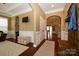 Open-concept living room featuring hardwood floors, wainscoting, and archways at 1022 Bimelech Dr, Indian Trail, NC 28079