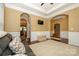 Bright living room featuring a trey ceiling, crown molding, and an oversized rug at 1022 Bimelech Dr, Indian Trail, NC 28079