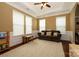 Bright living room featuring a trey ceiling, crown molding, and an oversized rug at 1022 Bimelech Dr, Indian Trail, NC 28079