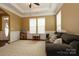 Bright living room featuring a trey ceiling, crown molding, and an oversized rug at 1022 Bimelech Dr, Indian Trail, NC 28079
