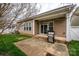 Covered patio with a gas grill, offering an ideal space for outdoor cooking and relaxation at 1022 Bimelech Dr, Indian Trail, NC 28079