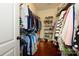 Spacious walk-in closet with ample storage space for clothes and shoes on shelving and hanging racks at 1022 Bimelech Dr, Indian Trail, NC 28079