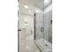 A modern bathroom features a glass-enclosed shower and sleek fixtures, offering a spa-like experience at 1022 Parker St, Monroe, NC 28112