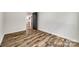 A simple bedroom features neutral walls and flooring, providing a blank canvas for personalization at 1022 Parker St, Monroe, NC 28112