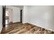A cozy bedroom features hardwood floors and neutral walls that create a peaceful and inviting retreat at 1022 Parker St, Monroe, NC 28112