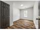 A bright bedroom features a window and neutral walls, complemented by modern flooring at 1022 Parker St, Monroe, NC 28112