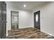 Inviting entryway featuring newly installed flooring and a stylish front door at 1022 Parker St, Monroe, NC 28112