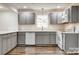 Modern kitchen featuring gray cabinetry, stainless steel appliances, and ample counter space at 1022 Parker St, Monroe, NC 28112