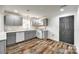 Beautifully updated kitchen featuring gray cabinets, new appliances, and stylish flooring at 1022 Parker St, Monroe, NC 28112