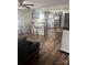 Well-lit kitchen with stainless steel appliances, white cabinetry, and a breakfast bar overlooking the living area at 1022 Parker St, Monroe, NC 28112