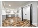 A spacious kitchen features gray cabinetry and modern appliances, perfect for cooking and entertaining at 1022 Parker St, Monroe, NC 28112