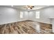Bright and airy living space featuring large windows and new flooring, perfect for relaxation at 1022 Parker St, Monroe, NC 28112