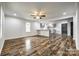 Spacious living room with abundant natural light and updated flooring, ideal for entertaining at 1022 Parker St, Monroe, NC 28112