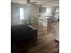 Open-concept living area featuring a kitchen island and a comfortable seating arrangement with ample natural light at 1022 Parker St, Monroe, NC 28112