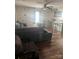 Comfortable living room with large sectional sofa, decor clock, and convenient kitchen access at 1022 Parker St, Monroe, NC 28112