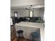 Open-concept living area featuring a kitchen island and a comfortable seating arrangement with ample natural light at 1022 Parker St, Monroe, NC 28112