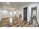 Bright open-concept living area that offers newly installed flooring and modern finishes at 1022 Parker St, Monroe, NC 28112