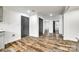 An open-concept living space showcases stylish wood-look flooring and neutral wall colors, creating an airy atmosphere at 1022 Parker St, Monroe, NC 28112