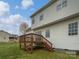 Home with a wooden deck leading to a grassy backyard, perfect for outdoor entertaining at 10827 Azure Valley Pl, Charlotte, NC 28269